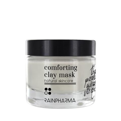 glazen pot met zwart deksel met zwarte tekst 'comforting clay mask rainpharma'